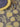 blue-grey placemat featuring a repeating yellow lemon print