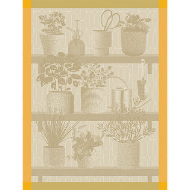 A beige tea towel with a floral and herbal design featuring various potted plants and gardening tools.