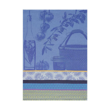 A blue kitchen towel with a floral pattern and a woven label, featuring Indian motifs such as tapenade, garlic, and tomatoes.