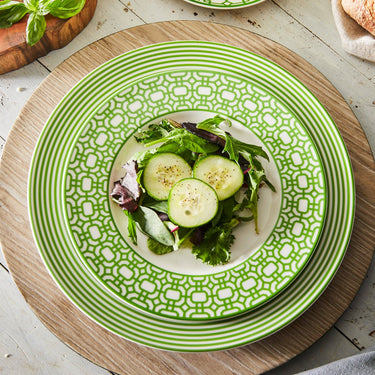 Caskata - Newport Garden Gate Verde Salad Plate - Vibrant Green Color Shown with striped dinner plate