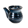 Blue ceramic teapot with a lid on a white background