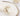 Decorative napkin with pearl embellishments on a white tablecloth.