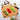 Vellum Wood Fiber Composite Cutting Board with Non-Skid Pads Shown with cut vegetables