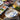 Crab Coupe Salad Plate Shownn on table with other Caskata blue and white pieces