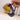 Navy mug with yellow moon and crane design held by a hand on a light background