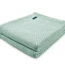 Image is Faribault Mill’s Bar Harbor blanket in Surf, folded neatly.