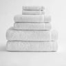 Stack of white bath towels on white background