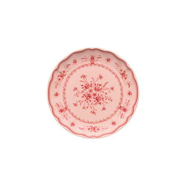 Decorative pink plate with floral patterns on a white background