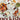 Book cover: Peckish by Suzanne Lenzer. Cover features several small plates with various foods in them. In the center it reads, “Suggestions for the Sophisticated Snacker.”
