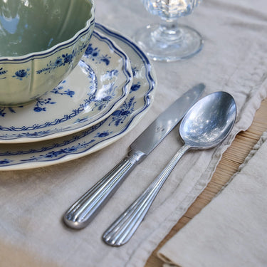 Douro Flatware Collection in Brushed Stainless shown in place setting with Vila Dinnerware Collection.