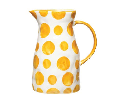 Yellow and white polka dot pitcher