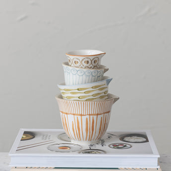 Stack of ceramic liquid measuring cups