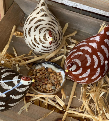 French ceramic poullets in red, white, and black
