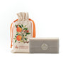 Cream sachet with oranges on it and a bar of orange soap.