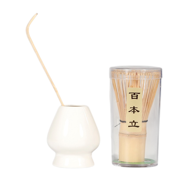 Set of matcha sticks in a glass container with a white holder on a white background