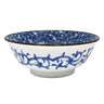 Ceramic bowl with blue floral pattern on a white background