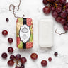 bar of grape soap on a marble background with grapes
