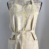 Patterned apron on a mannequin against a plain background