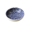 Small ceramic bowl with blue and white pattern on a white background