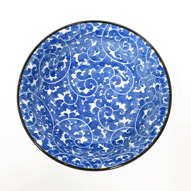 Round blue and white patterned object on a white background