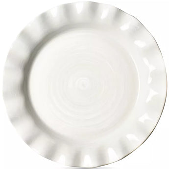 Cream colored dinner plate with ruffled edge, shiny finish