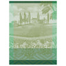 A green tea towel with a vineyard and trees design, featuring a woven label.