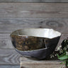 Handmade bowl in shades of blue, back, brown, and cream